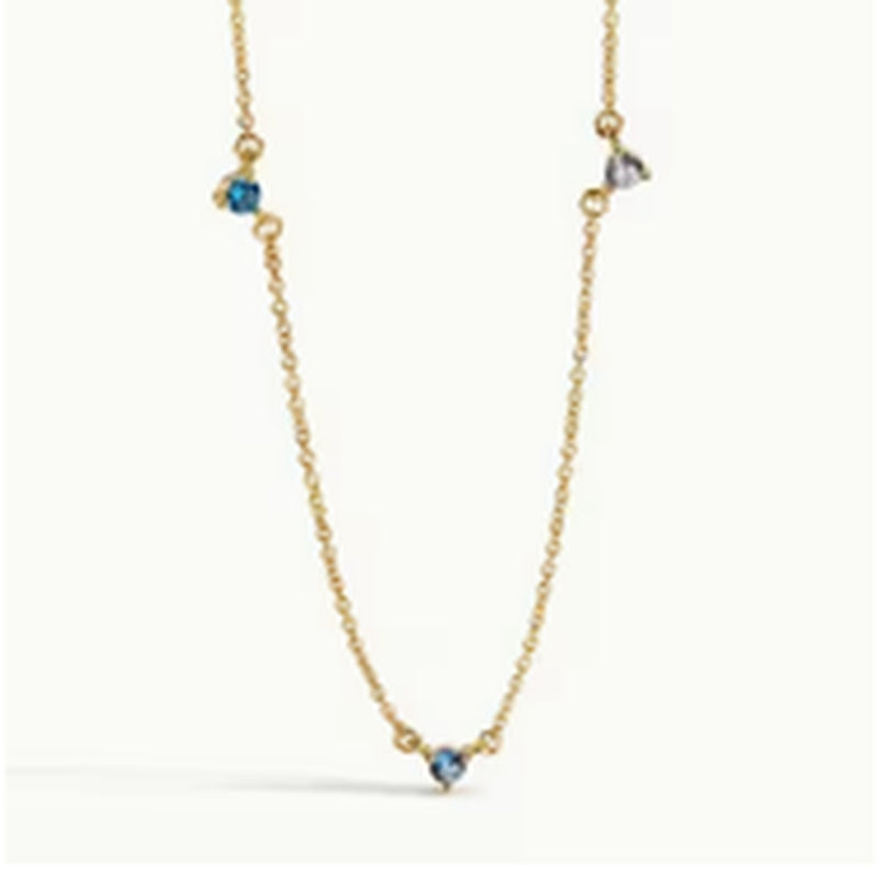 Fine gold-tone necklace with blue stone accents