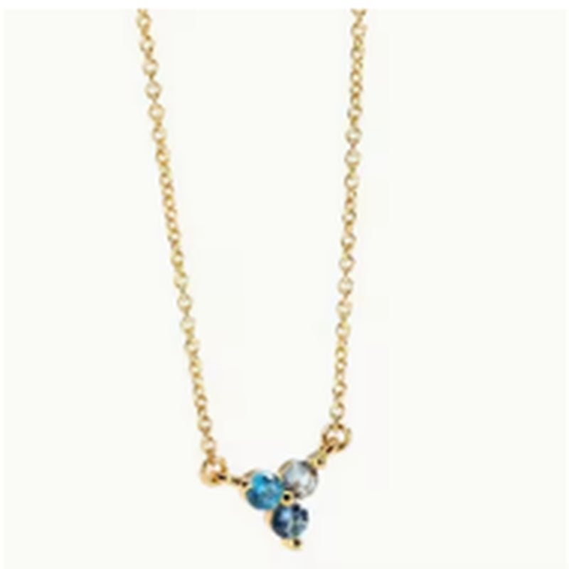 Gold-tone necklace with blue gemstone cluster pendant