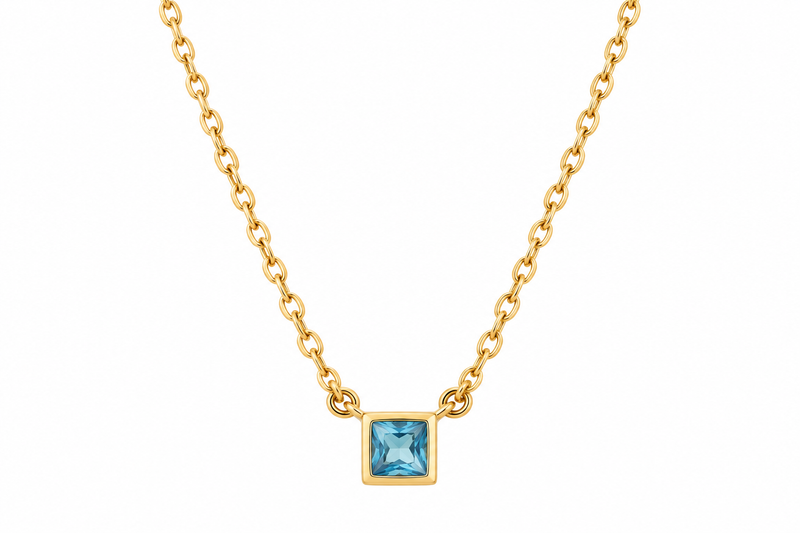 Lagoon gold necklace with square blue gemstone on a white background