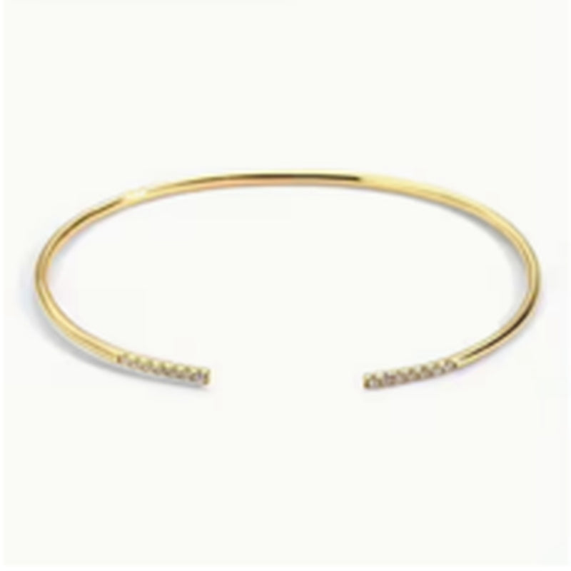 Gold-tone open cuff bracelet with sparkling ends